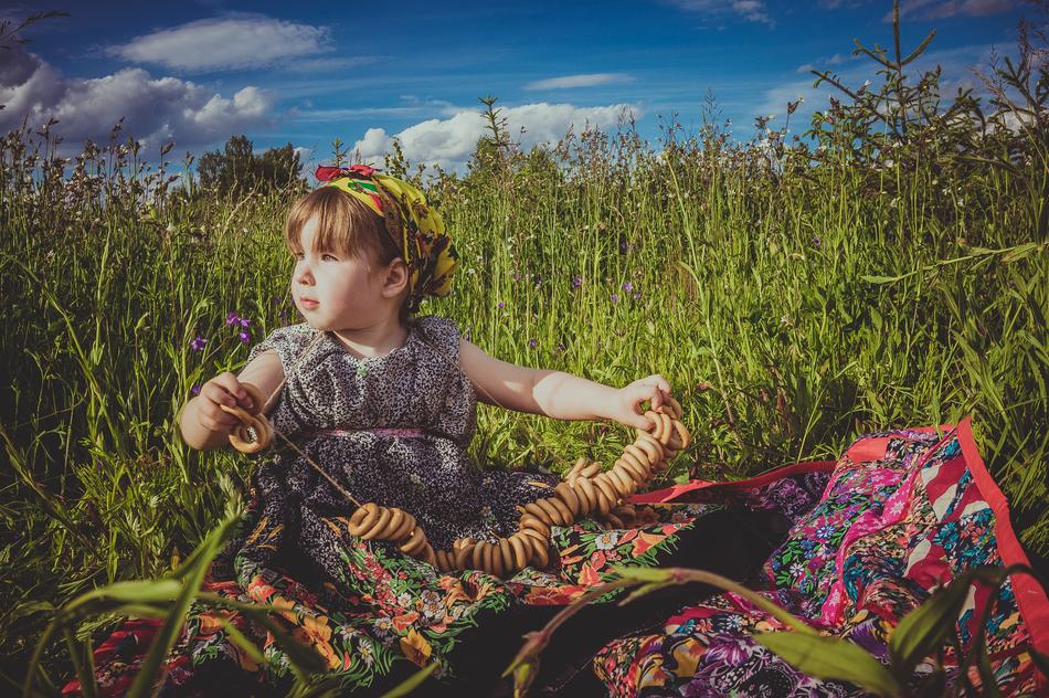 cute baby sitting in the grass