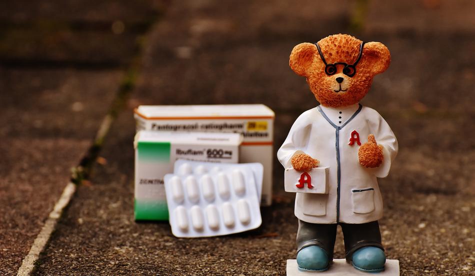 figure of doctor bear next to the medicine