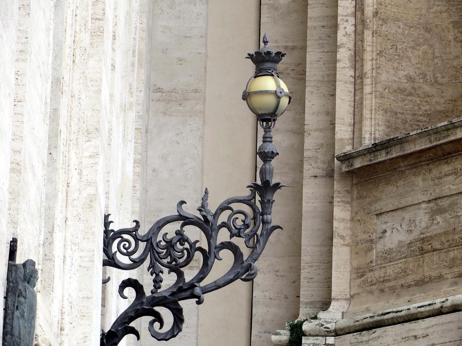 an old lamp on the background of a building