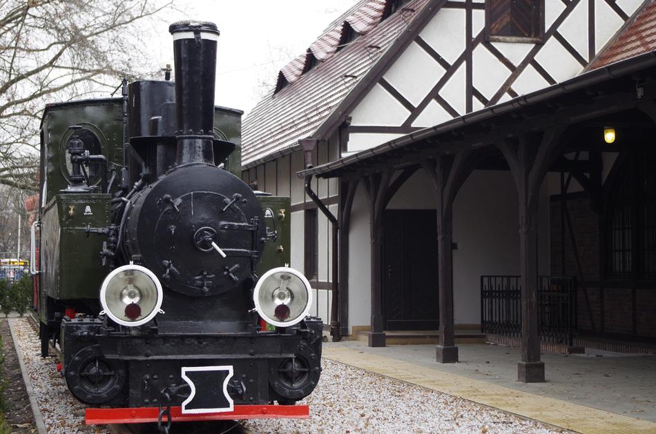 The old train is black in the distance
