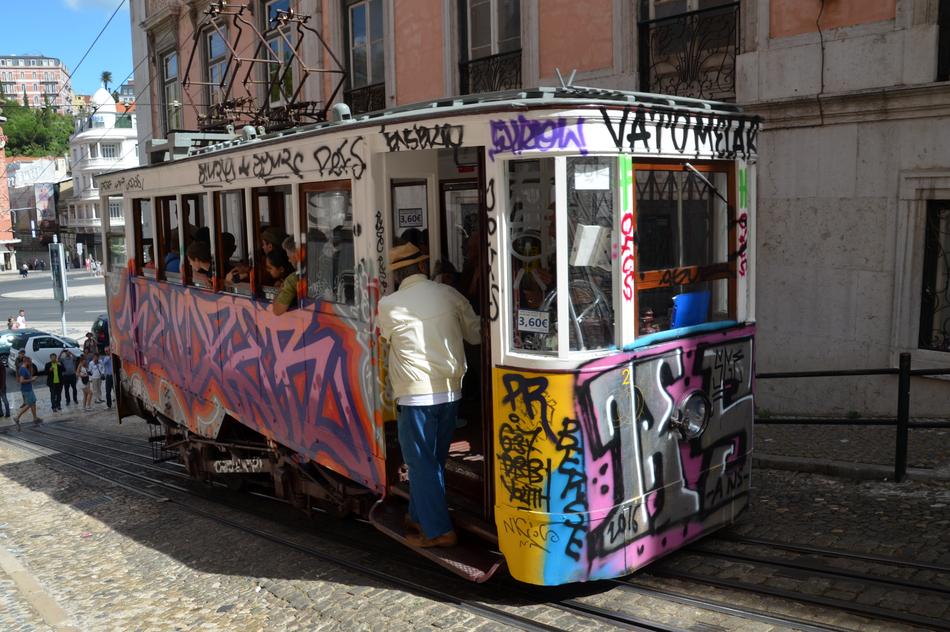 colorful beautiful streetcar with people
