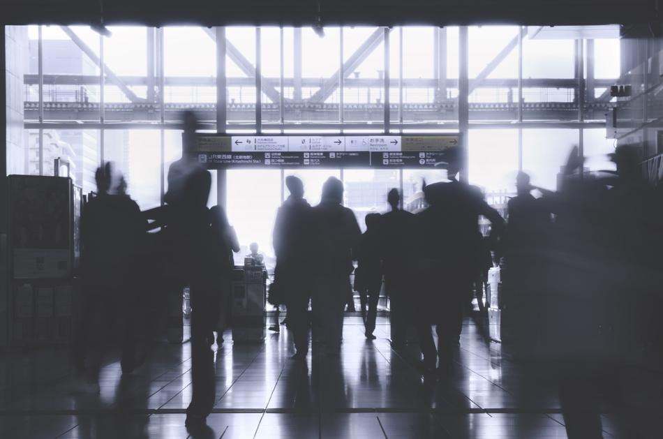 black and white image of people at the station