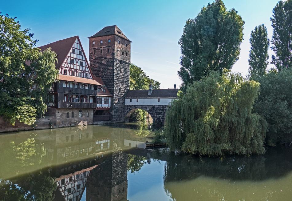 Beautiful and colorful houses, near the green water and plants, in Nuremberg, Germany