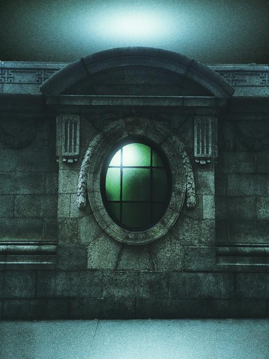 painted round green window in the castle wall