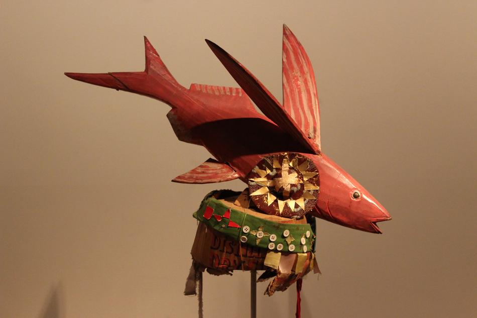 red wooden figurine of Flying fish