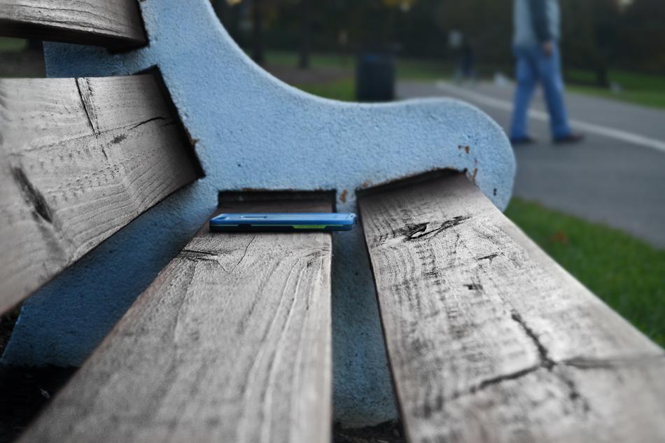 cellphone on the wooden bench