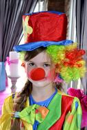 girl in colorful clown costume