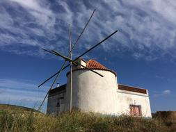 blue sky over historic windmill