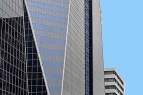 Beautiful skyscrapers with windows, at blue sky on background