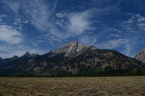 rocky mountain under a blue sky