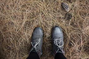 girl in boots on the hay