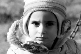 Portrait of serious Child girl in winter clothing