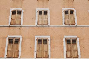 building facade with wooden shutters