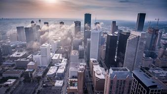 Cityscape with the colorful downtown of the city, with the clouds, in sunlight