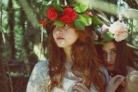 portrait of Beautiful girls with Flowers wealth on a head