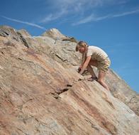 Child Girl Climbs rock