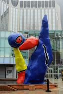 Colorful figure near the facade of the building in Paris, France