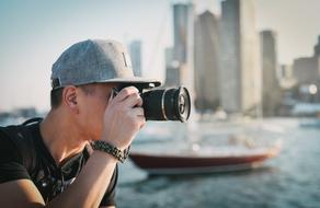 photographer on the background of the city with skyscrapers