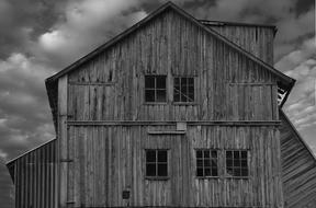 black and white photo of an abandoned hangar
