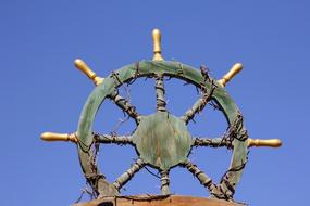 photo of the steering wheel against the blue sky