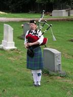 bagpiper in traditional clothes