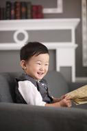 happy boy with book in hand