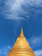 golden dome of the temple against the blue sky