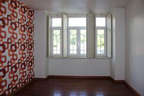 photo of a room with abstract wallpaper