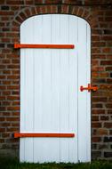 Beautiful, white and red door of the farm in Southern Jutland, Denmark