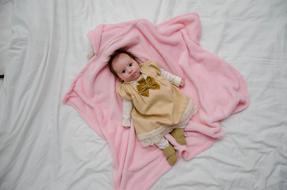 asian Baby girl on Bed