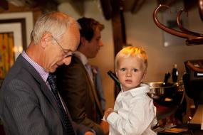 grandfather with granddaughter at a family celebration