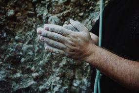 dusty hands of a climber