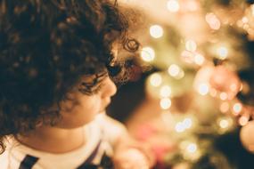 photo of girl and christmas lights