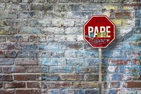 brick wall background with road sign