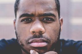 Facial Close-Up of serious young dark skin Man