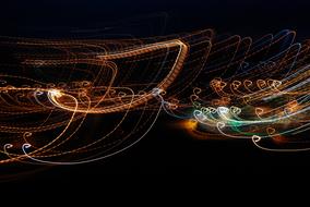 Beautiful and colorful lights with curves at black background