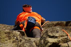 climber on a rock, bottom view