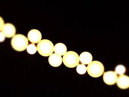 glowing round lamps on the background of the night sky