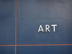 Art, white lettering at Blue wall