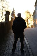 man silhouette in the city at sunset