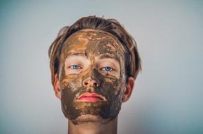 woman in clay mask