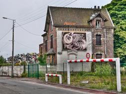 Scrap Dealer House among the plants