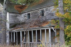 Old abandoned village House with terrace at fall