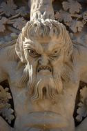 stone sculpture with a scary face