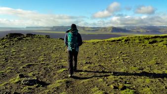 man with a backpack as hiking