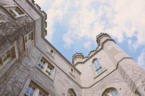 courthouse under white clouds in the sky