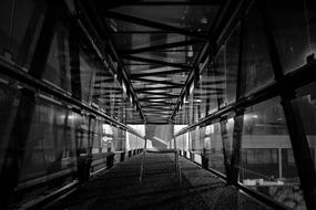 monochrome Perspective picture of chair on a bridge in building