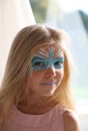 girl with a painted blue mask