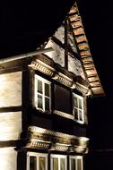 Lighting on facade of old Truss building