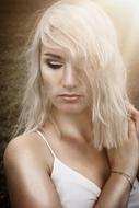 Pretty blonde young Girl looking down, portrait